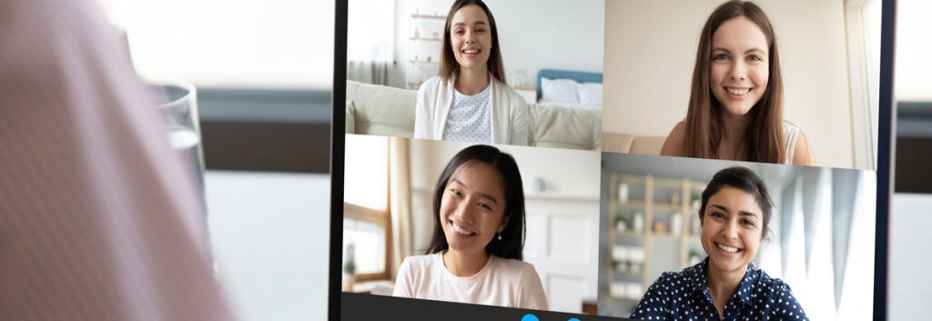4 faces appear on a laptop screen, as in an online meeting.