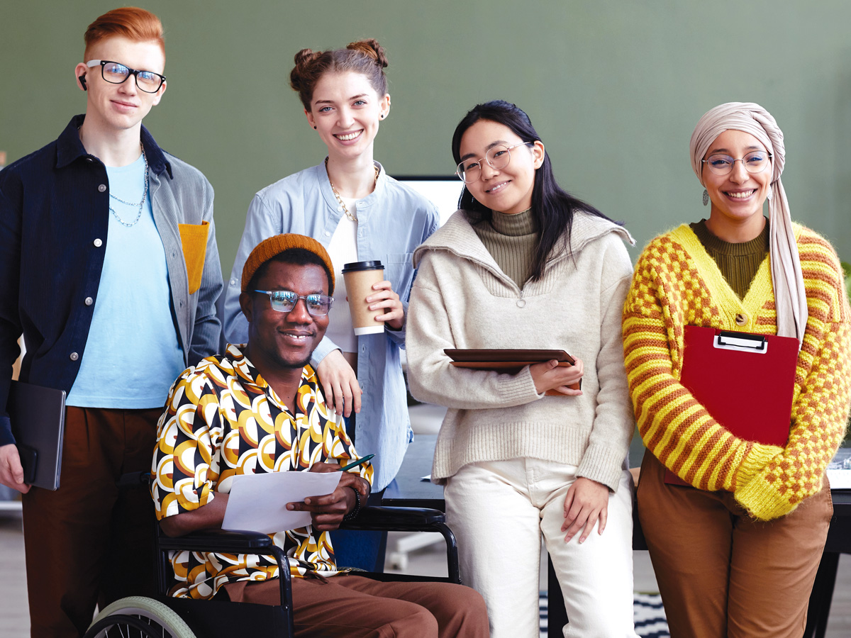 a diverse group of young adults smiling